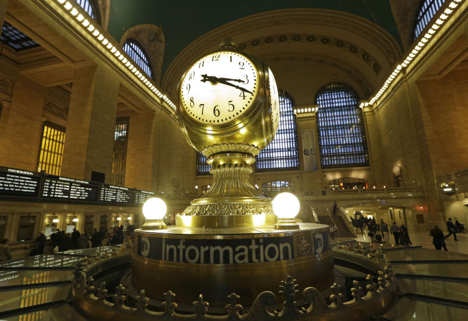 The famous opalescent clock keeps time at the center of the main concourse in Grand Central Terminal is shown in New York, Wednesday, Jan. 9, 2013. The country's most famous train station and one of its finest examples of Beaux Arts architecture in America turns 100 on Feb. 1. The building's centennial comes 15 years after a triumphant renovation that removed decades of grime and decay. (AP Photo/Kathy Willens)