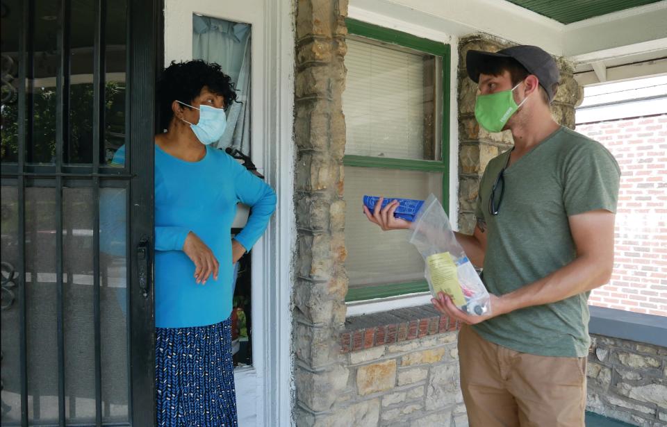 Ben Carpenter speaks with a resident of Kansas City, Mo, about making their home more efficient as part of a "Leak Stoppers" program run by local nonprofit Bridging the Gap. Kristin Riott, executive director of the nonprofit, says increasing energy and water efficiency can improve the health and wellbeing of the city's residents, while also lowering energy bills and greenhouse gas emissions.