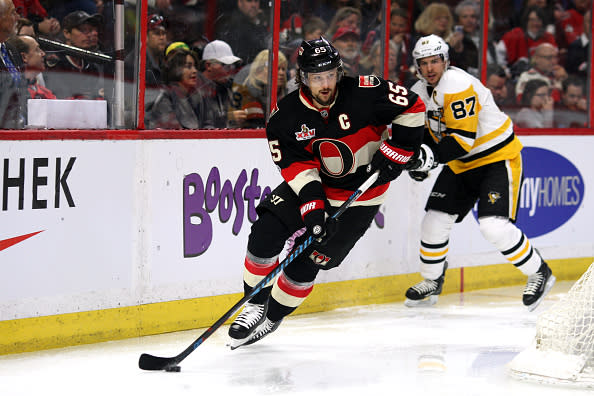 OTTAWA, ON - MARCH 23: Ottawa Senators Defenceman Erik Karlsson (65) moves the puck around the goal with Pittsburgh Penguins Center Sidney Crosby (87) in the background during the first period in a game between the Pittsburgh Penguins and Ottawa Senators on March 23, 2017, at Canadian Tire Centre in Ottawa, On. (Photo by Jason Kopinski/Icon Sportswire via Getty Images)