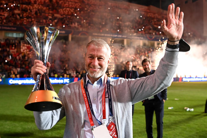 Roman Abramovich, owner of Chelsea FC, holds up the FIFA Club World Cup trophy after his team&#x002019;s victory.