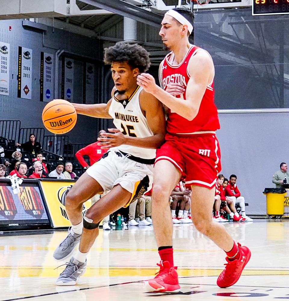 Boston University forward Anthony Morales (22) guards UW-Milwaukee guard Justin Thomas (25) during the second half, Nov. 27, 2022, in Milwaukee.