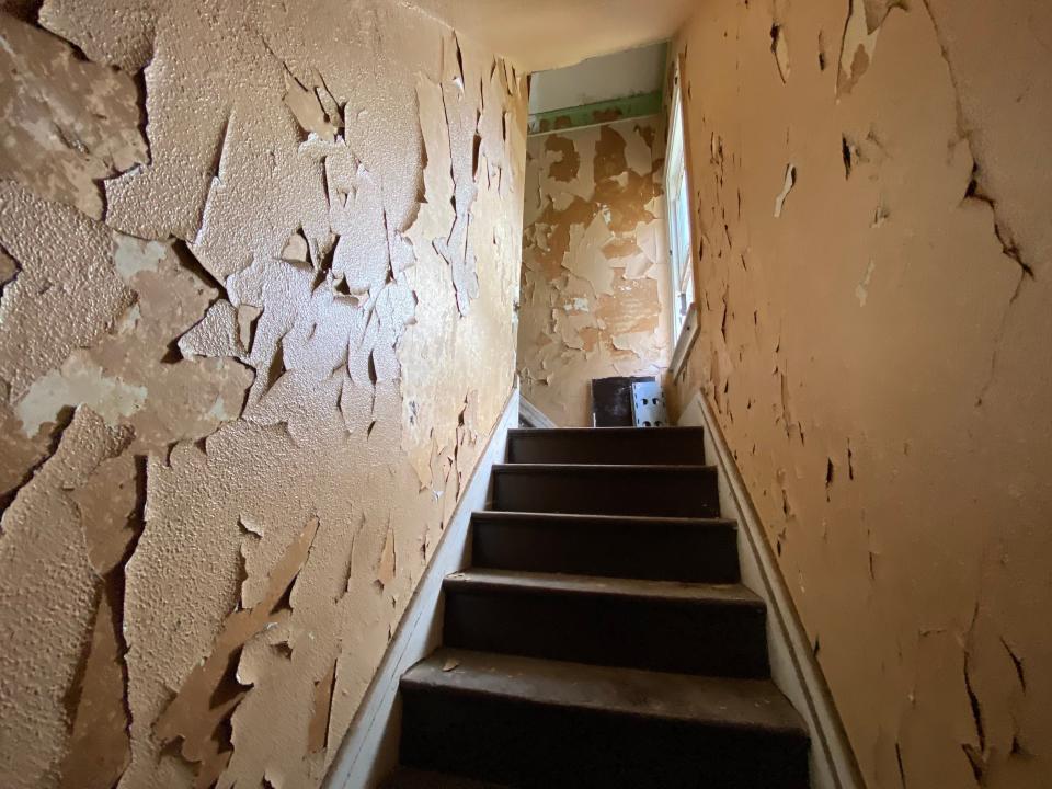 detroit land bank authority staircase with peeling paint