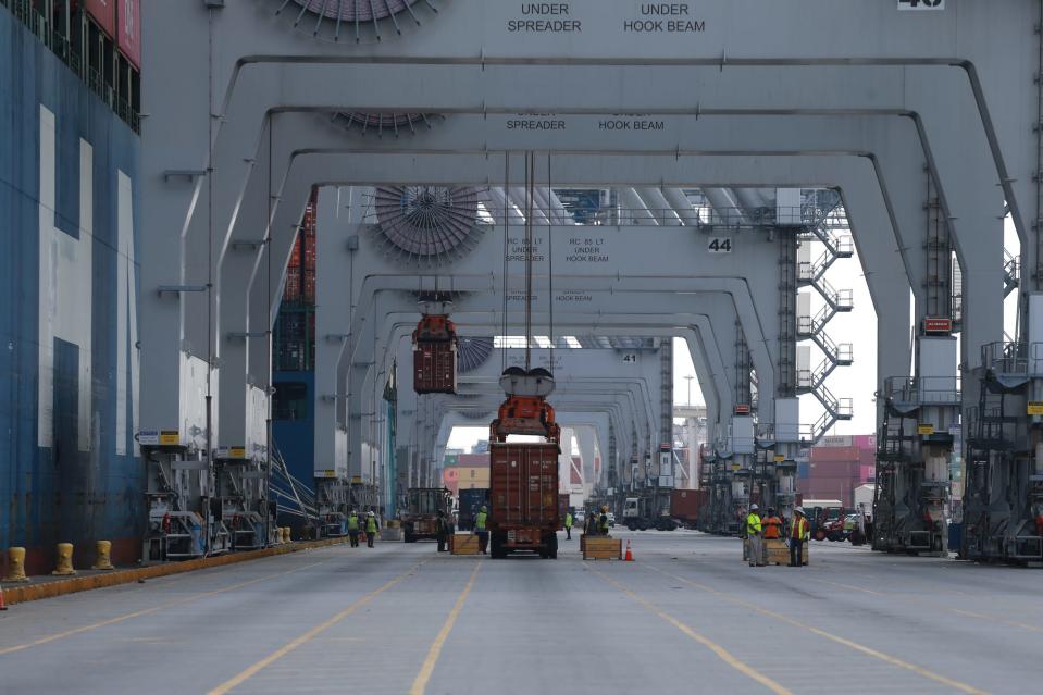 Containers are loaded on and off of the Hyundai Smart Friday October, 15 2021 at the Georgia Ports Authority.