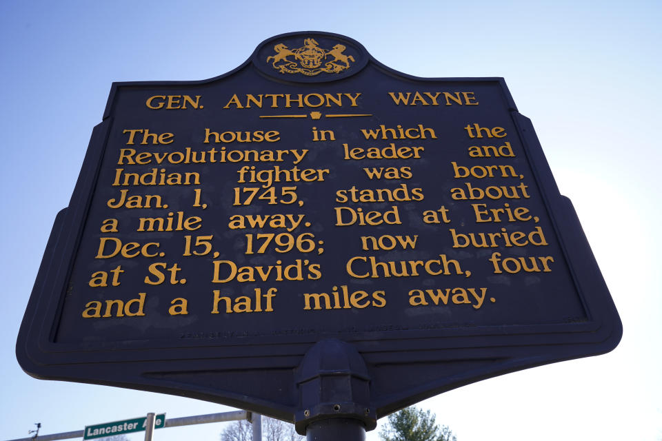 Shown is a Pennsylvania Historical Marker for Revolutionary War Gen. Anthony Wayne in Paoli, Pa., Thursday, Nov. 18, 2021. A recent review of all 2,500 markers the Pennsylvania Historical and Museum Commission had been installing for more than a century, faced a fresh round of questions about just whose stories were being told on the state's roadsides, and the language used to tell them. The increased scrutiny that has focused on factual errors, inadequate historical context and racist or otherwise inappropriate references, prompting the state to remove two markers, revise two and order new text for two others so far. The changes have become grist for the political mill. (AP Photo/Matt Rourke)