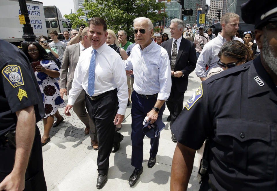Former vice president and Democratic presidential candidate Joe Biden walks with Boston Mayor Marty Walsh, left, on Wednesday, June 5, 2019, in downtown Boston. (AP Photo/Steven Senne)