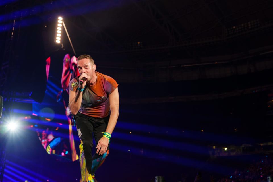 Coldplay frontman Chris Martin performs at State Farm Stadium on May 12, 2022 in Glendale, AZ.