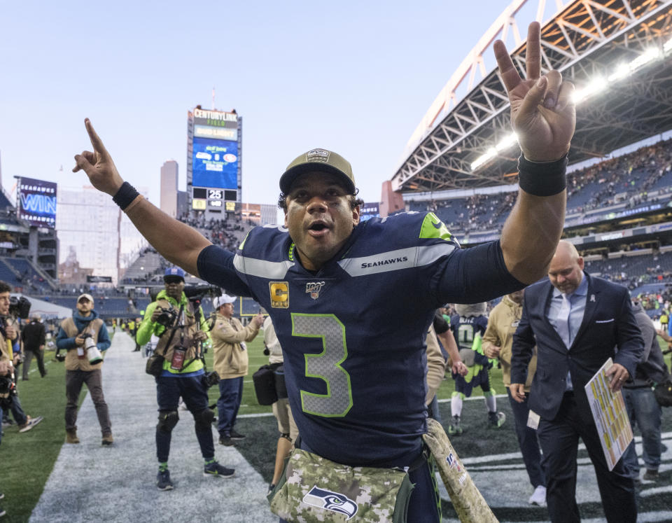 SEATTLE, WA - NOVEMBER 3: Russell Wilson #3 of the Seattle Seahawks celebrates as he leaves the field after a game against the Tampa Bay Buccaneers at CenturyLink Field on November 3, 2019 in Seattle, Washington. The Seahawks won 40-34 in overtime. (Photo by Stephen Brashear/Getty Images)