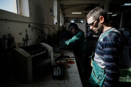 Employees works at a recycling factory in Belgrade, Serbia, February 28, 2019. Picture taken February 28, 2019. REUTERS/Marko Djurica