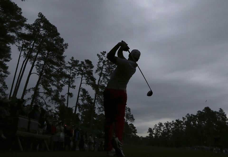 Sergio Garcia tees off on the 14th hole beneath a stormy sky just before play was suspended during practice for the Masters golf tournament at Augusta National Golf Club, Wednesday, April 5, 2017, in Augusta, Ga. (Curtis Compton/Atlanta Journal-Constitution via AP)