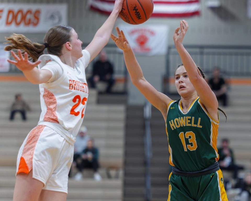 Brighton's Noelle Ebel (22) blocks a shot from Howell's Gabby Piepho (13) during the Bulldogs' 42-35 victory Friday, Feb. 9, 2024.