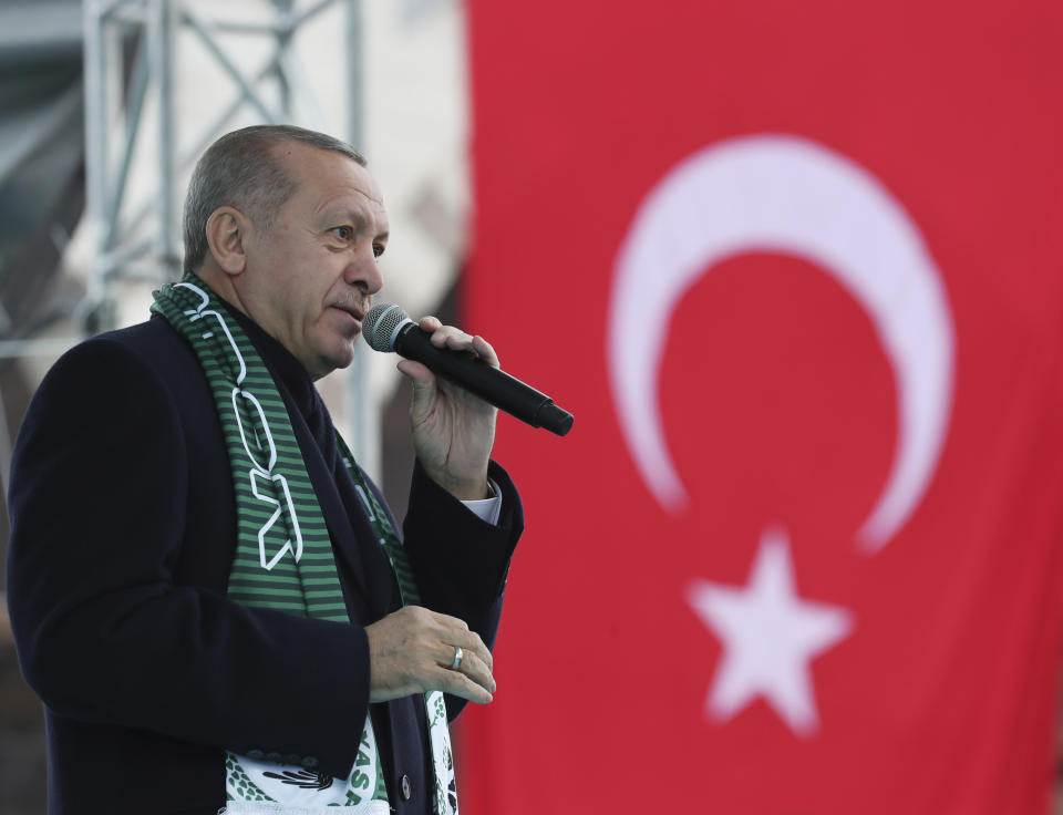 Turkey's President Recep Tayyip Erdogan delivers a speech during a rally in Konya, Turkey, Monday, Dec. 17, 2018. Erdogan said he received "positive answers" from U.S. President Donald Trump on the situation in northern Syria, where Turkey has threatened to launch a new operation against American-backed Syrian Kurdish fighters. The two leaders spoke by phone Friday. (Presidential Press Service via AP, Pool)