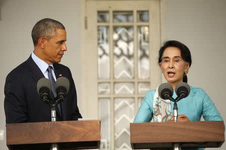 U.S. President Barack Obama and opposition politician Aung San Suu Kyi hold a press conference after their meeting at her residence in Yangon, November 14, 2014. REUTERS/Kevin Lamarque