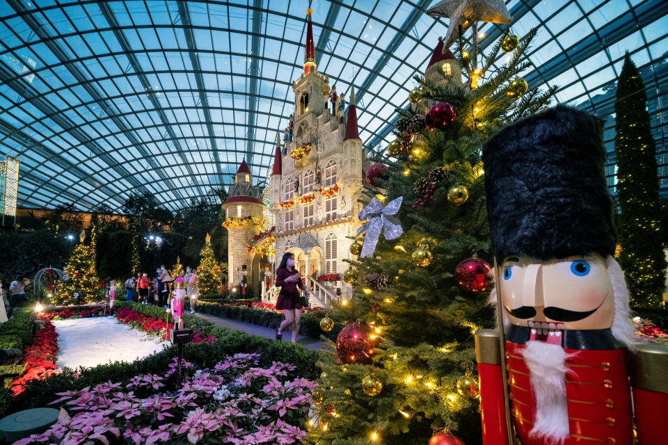 Visitors at the Poinsettia Wishes floral display, as part of the Christmas celebrations at Gardens by the Bay in Singapore.