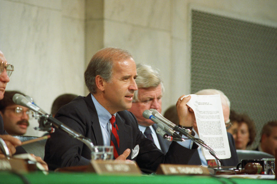 Biden holding up a copy of the FBI report on Hill during the 1991 committee hearings on Thomas.&nbsp; (Photo: Bettmann via Getty Images)