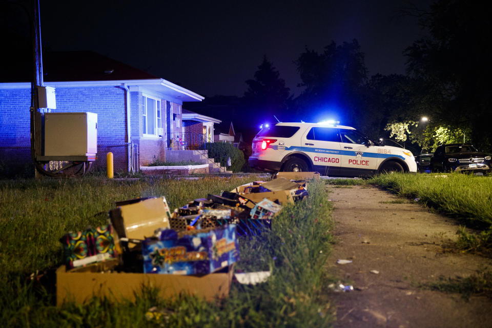 Fireworks sit on the ground at the scene where a young girl and woman were shot on the 100 block of East 119th Place in the West Pullman neighborhood during the Fourth of July holiday weekend in the early hours of Monday, July 5, 2021, in Chicago. (Armando L. Sanchez/Chicago Tribune via AP)