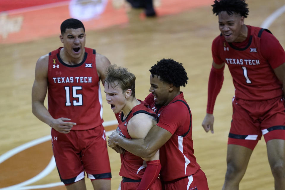 Texas Tech guard Mac McClung (0) is grabbed by guard Kyler Edwards (11) as they celebrate McClug's winning basket in the final seconds of the second half of an NCAA college basketball game against Texas, Wednesday, Jan. 13, 2021, in Austin, Texas. Texas Tech won 79-77. (AP Photo/Eric Gay)