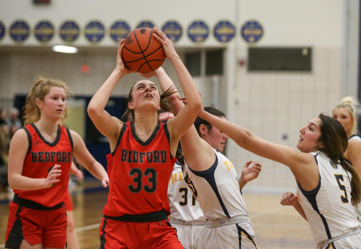 Bedford's Victoria Gray goes up for a putback against Trenton in the finals of the Division 1 District at Trenton. Gray has been named Division 1 Second-Team All-State by The Associated Press.