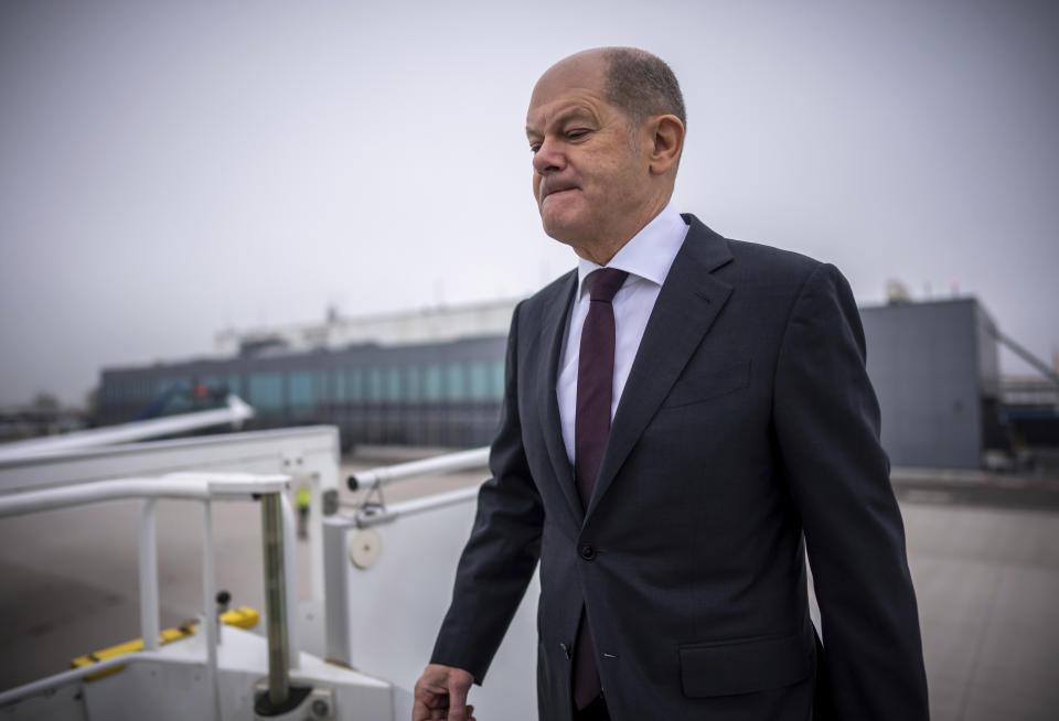 German Chancellor Olaf Scholz boards an Airbus of the Air Force's Air Wing at the military section of Berlin Brandenburg Airport to fly to the USA, in Schönefeld, Germany, Thursday, Feb. 8, 2024. Scholz pushed for further U.S. and European aid for Ukraine as he set off Thursday for a visit to Washington, declaring that it's time to send Russian President Vladimir Putin a “clear signal” that the West won't let up on supporting Kyiv. Scholz is due to meet members of the U.S. Congress on Thursday and President Joe Biden on Friday. (Michael Kappeler/dpa via AP)