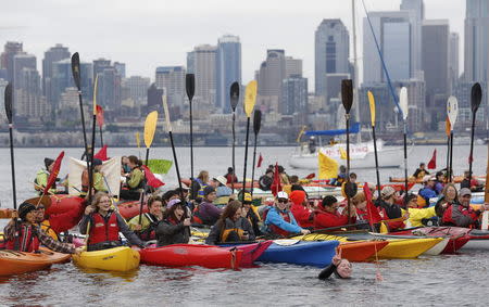 Activists protest the Polar Pioneer at Terminal 5 at the Port of Seattle, Washington May 16, 2015. REUTERS/Jason Redmond