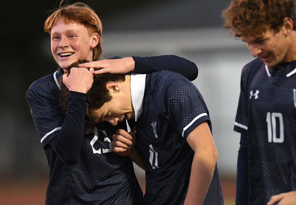 Hoggard's #11 Clark Beery is congratulated by #23 Jalen Criss after scoring a goal as Hoggard took on Broughton in the first round of the State Playoff’s for soccer Thursday Nov. 2, 2023 at Scott Braswell Stadium in Wilmington, N.C. KEN BLEVINS/STARNEWS
