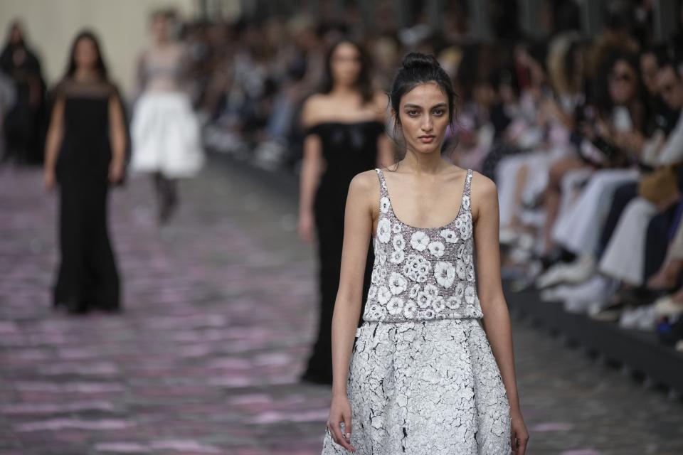 A model wears a creation for the Chanel Haute Couture Fall/Winter 2023-2024 fashion collection presented in Paris, Tuesday, July 4, 2023. (AP Photo/Christophe Ena)