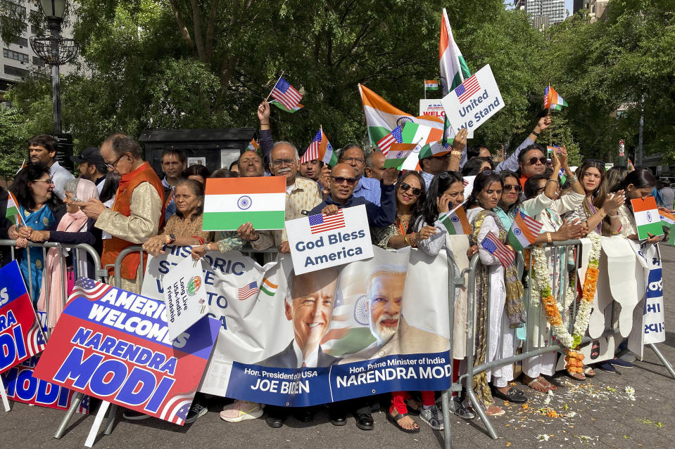 Supporters gather near the United Nations headquarters to welcome India Prime Minister Narendra Modi, Wednesday, June 21, 2023, in New York. Modi joined diplomats and dignitaries at the United Nations for a morning session of yoga, praising it as "truly universal" and "a way of life." (AP Photo/Edith M. Lederer)