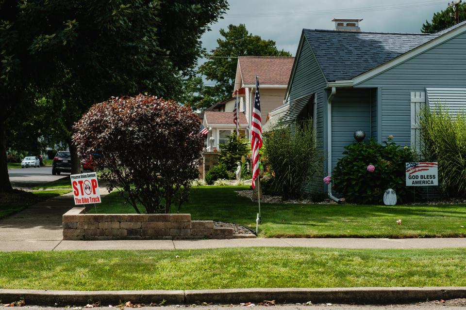 'Stop The Bike Track' signs can be seen along Union Ave., Wednesday, Aug. 30 in New Philadelphia.