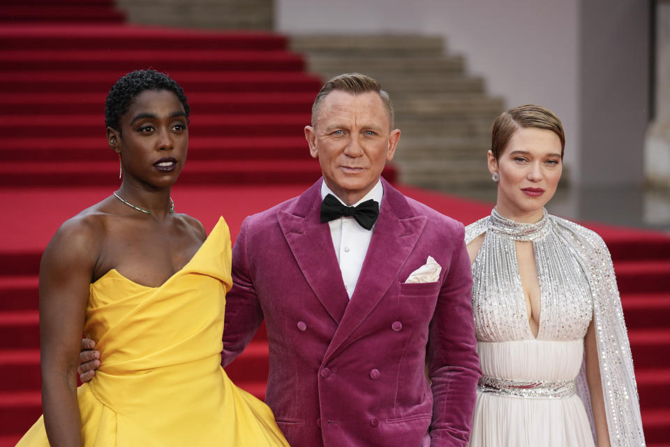 Lashana Lynch, from left, Daniel Craig and Lea Seydoux pose for photographers upon arrival for the World premiere of the new film from the James Bond franchise 'No Time To Die', in London Tuesday, Sept. 28, 2021. (AP Photo/Matt Dunham)