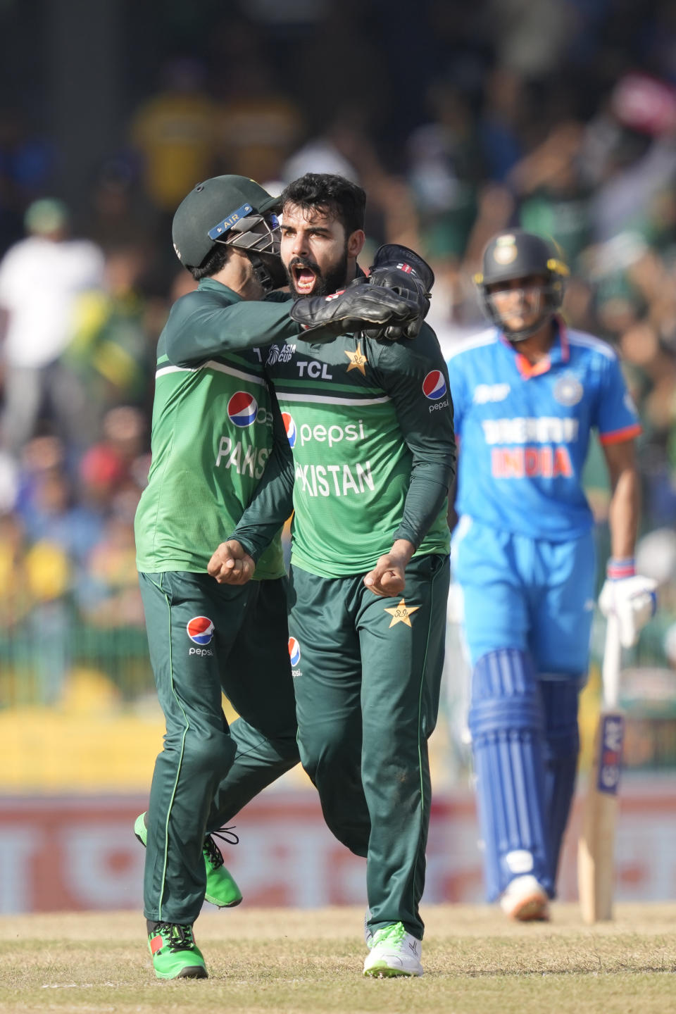 Pakistan's Shadab Khan, right, celebrates taking the wicket of India's Rohit Sharma during the Asia Cup cricket match between India and Pakistan in Colombo, Sri Lanka, Sunday, Sept.10, 2023. (AP Photo/Eranga Jayawardena)