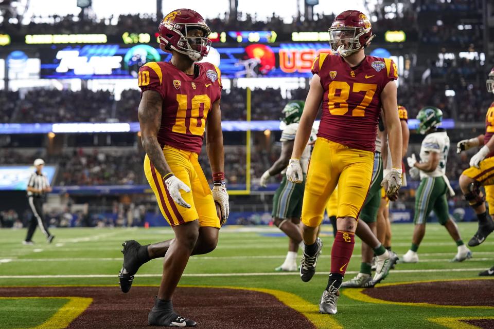 Southern California wide receiver Kyron Hudson (10) scores a touchdown during the second half of the Cotton Bowl NCAA college football game against Tulane, Monday, Jan. 2, 2023, in Arlington, Texas. (AP Photo/Sam Hodde)