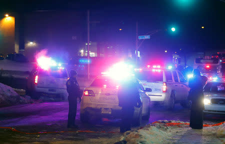 Police officers are seen near a mosque after a shooting in Quebec City. REUTERS/Mathieu Belanger