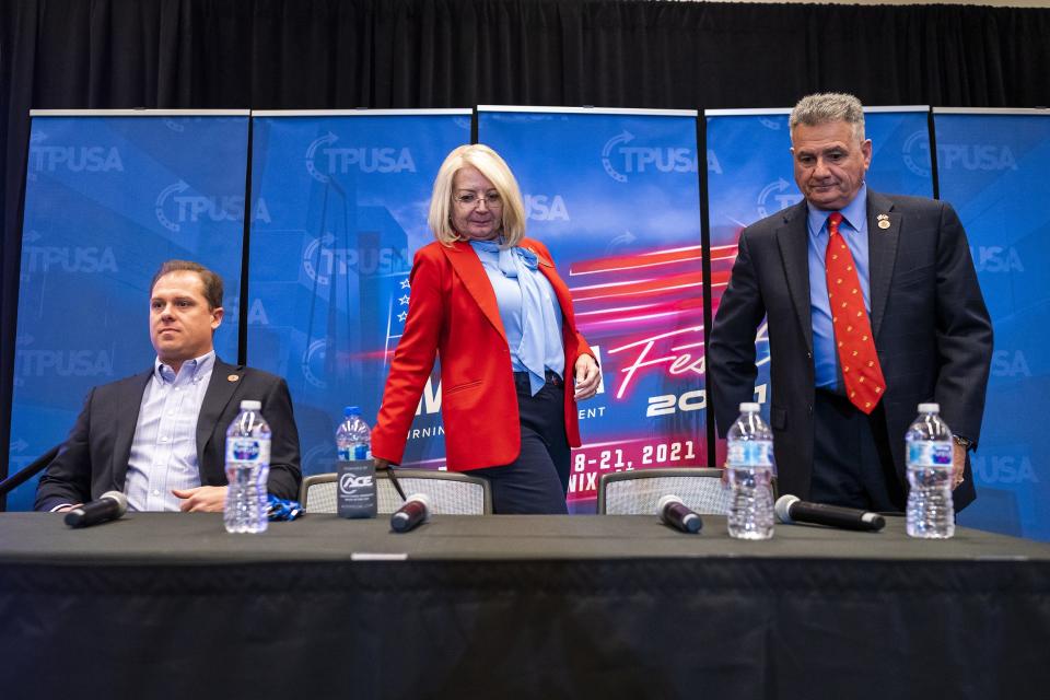 From left, State Rep. Jake Hoffman, Senate President Karen Fann, and Sen. Sonny Borelli, R-Lake Havasu City, take their seats before a breakout session focusing on Arizona elections during the second day of AmericaFest 2021 hosted by Turning Point USA on Sunday, Dec. 19, 2021, in Phoenix.