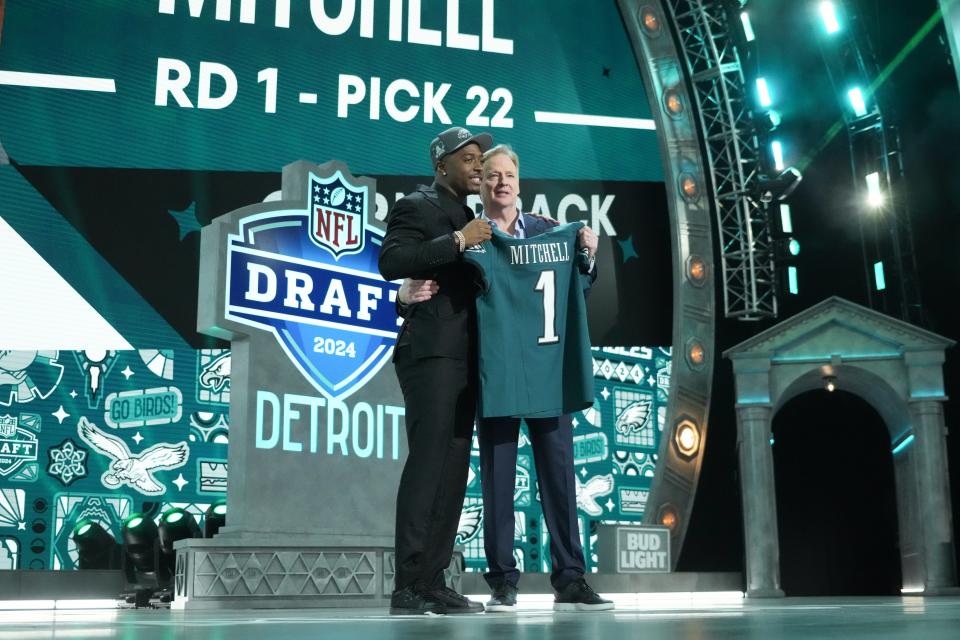 Toledo Rockets cornerback Quinyon Mitchell poses with NFL commissioner Roger Goodell after being selected by the Philadelphia Eagles as the No. 22 pick in the first round of the 2024 NFL Draft at Campus Martius Park and Hart Plaza in Detroit.