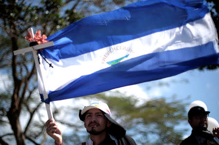 A Nicaraguan expat living in Costa Rica takes part in the "Caravan for Liberty and Justice" to protest against the government of Nicaraguan President Daniel Ortega, in La Cruz, Costa Rica border with Nicaragua, December 16, 2018. REUTERS/Juan Carlos Ulate