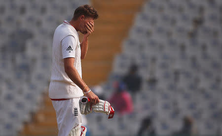 Cricket - India v England - Third Test cricket match - Punjab Cricket Association Stadium, Mohali, India - 29/11/16. England's Joe Root reacts after the dismissal of his teammate Jos Buttler. REUTERS/Adnan Abidi