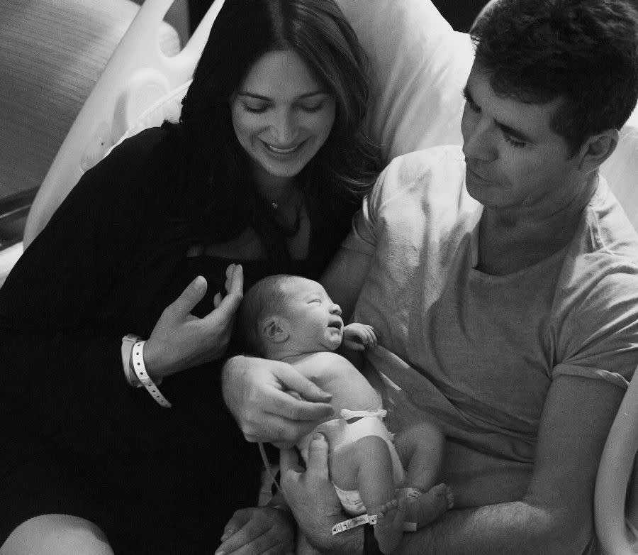 Simon Cowell and his baby mama Lauren Silverman couldn't look happier -- the couple were all smiles as they cradled their adorable newborn baby Eric in some intimate snaps taken by a friend at Lenox Hill Hospital in Manhattan on Feb. 15, 2014.