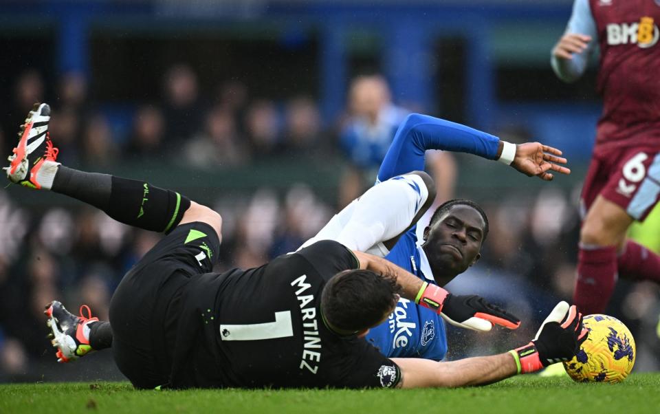 Emiliano Martinez and Amadou Onana come together