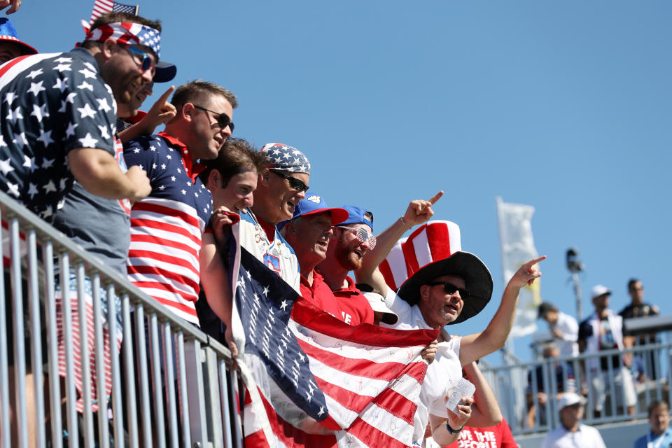 <p>Fans of the U.S. Team look on over the first tee prior to Thursday foursomes matches of the Presidents Cup at Liberty National Golf Club on Sept. 28, 2017 in Jersey City, N.J. (Photo: Rob Carr/Getty Images) </p>