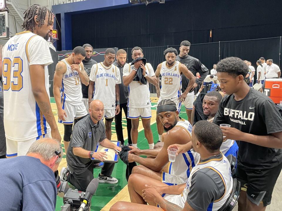 Blue Collar U coach Adam Bauman talks to his team during the Elam Ending of Monday's TBT first round win over Big 5 at the Oncenter War Memorial in Syracuse.