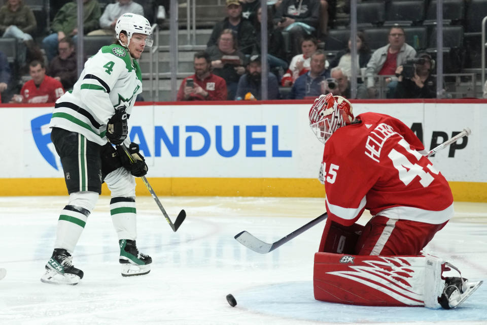 Detroit Red Wings goaltender Magnus Hellberg (45) stops a Dallas Stars defenseman Miro Heiskanen (4) shot in the third period of an NHL hockey game Monday, April 10, 2023, in Detroit. (AP Photo/Paul Sancya)