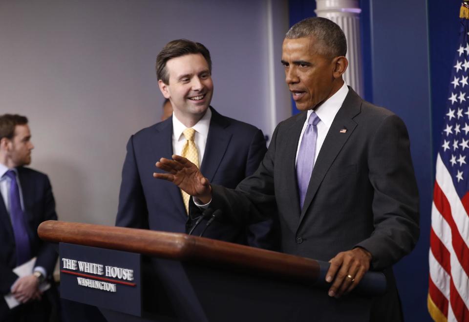 White House press secretary Josh Earnest listens as President Barack Obama speaks at his final daily press briefing, Tuesday, Jan. 17, 2017, in the briefing room of the White House in Washington. (AP Photo/Pablo Martinez Monsivais)