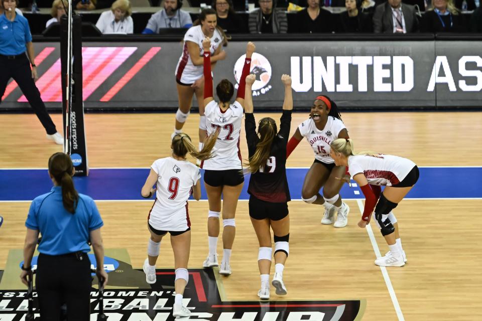 Dec 15, 2022; Omaha, Nebraska, US; The Louisville Cardinals celebrate the win against the Pittsburgh Panthers in the semi-final match at CHI Health Center. Mandatory Credit: Steven Branscombe-USA TODAY Sports