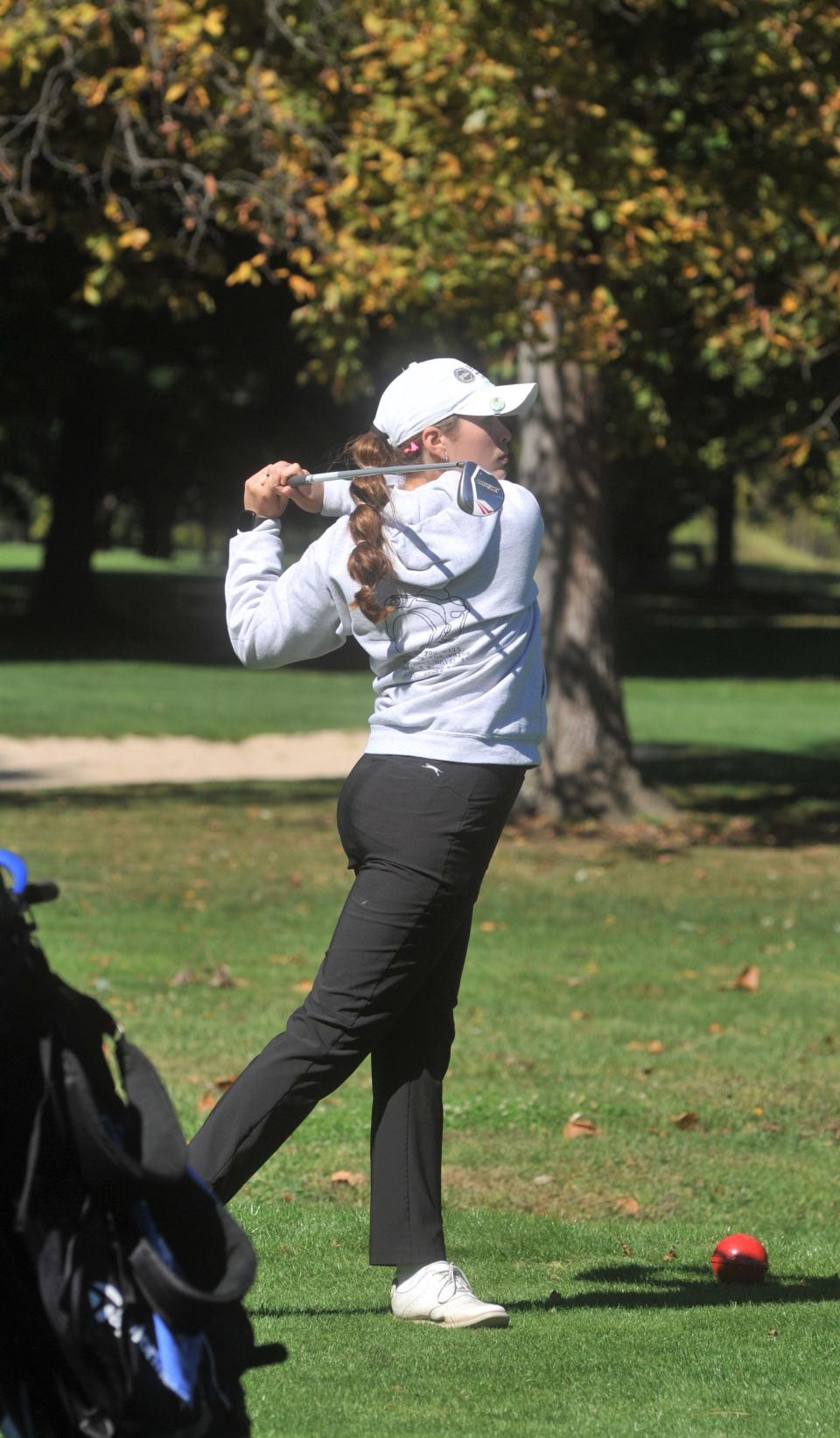 Plymouth's Sarah Hoak watches her tee shot on No. 11 at Sycamore Springs Golf Course in the Division II district tournament.