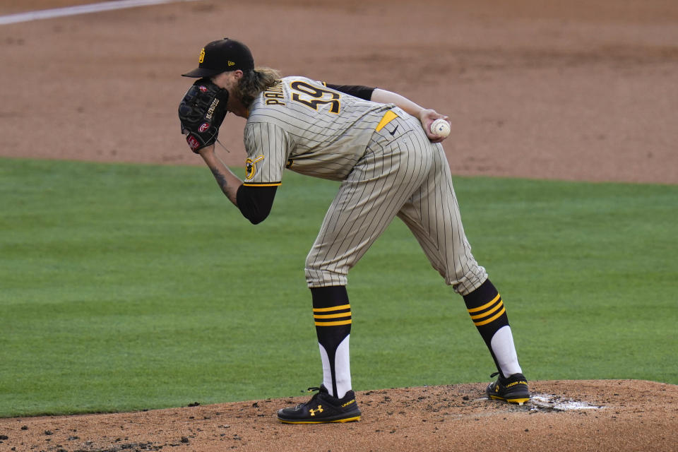 San Diego Padres starting pitcher Chris Paddack reads the signs while pitching against the Los Angeles Dodgers during the first inning of a baseball game, Thursday, Aug. 13, 2020, in Los Angeles. (AP Photo/Jae C. Hong)