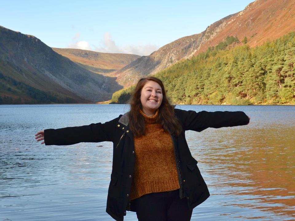 alexis posing in front of a lake in ireland