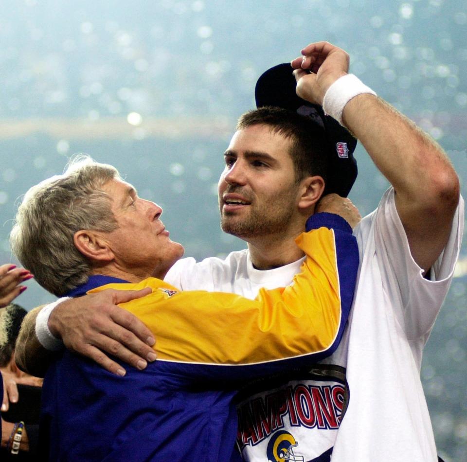 FILE - In this Jan. 30, 2000, file photo, St. Louis Rams quarterback Kurt Warner, right, gets a hug from Rams coach Dick Vermeil after the Rams defeated the Tennessee Titans 23-16 to win Super Bowl XXXIV in Atlanta. Vermeil hada successful seven-year run as coach of Philadelphia from 1976-82, taking the Eagles to their first Super Bowl following the 1980 season. But Vermeil burned out of coaching and stepped away after the 1982 season. Vermeil then launched a successful broadcast career before finally going back to the sidelines in 1997 with the Rams. St. Louis won just nine games his first two years before breaking through with the Super Bowl title in the 1999 season. (AP Photo/Dave Martin, File)