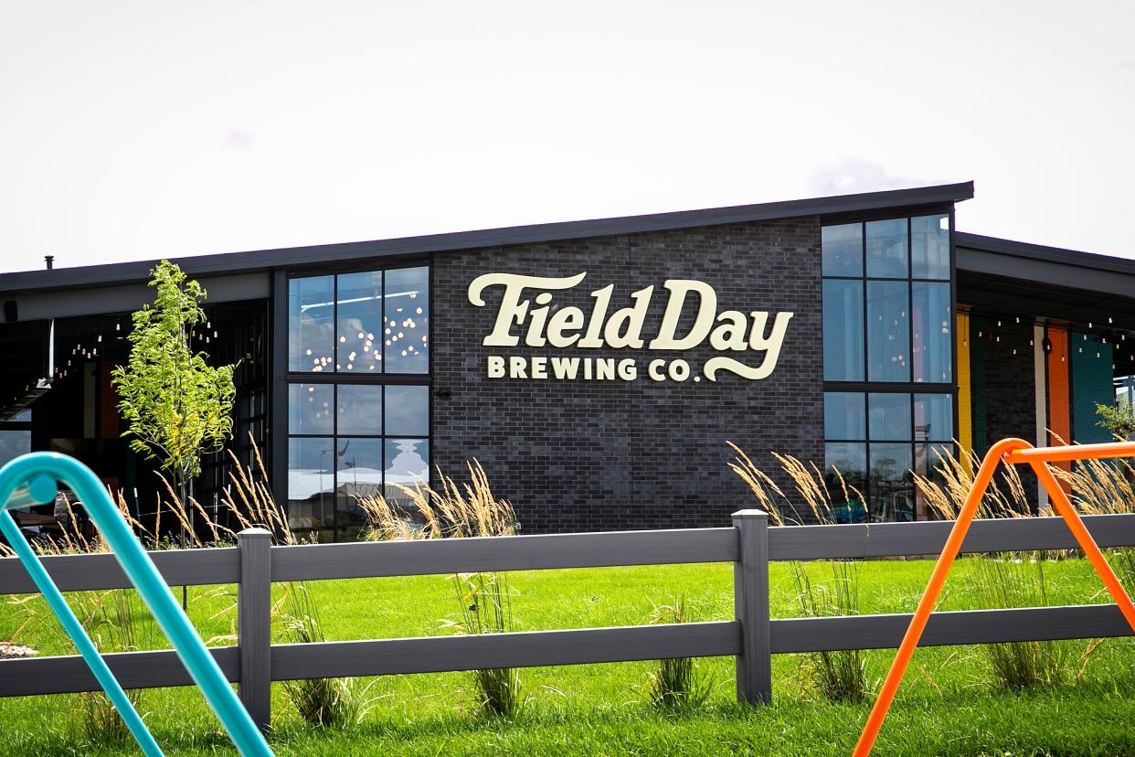 Field Day Brewing Co. is seen past a fence and parking areas for bicycles, Thursday, July 13, 2023, at 925 Liberty Way in North Liberty, Iowa. Hodge Construction served as the general contractor for the building that was designed by Slingshot Architecture.