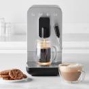 <p>Williams Sonoma</p><p><strong>$999.95</strong></p><p><a href="https://go.redirectingat.com?id=74968X1596630&url=https%3A%2F%2Fwww.williams-sonoma.com%2Fproducts%2Fsmeg-medium-fully-automatic-coffee-machine&sref=https%3A%2F%2Fwww.delish.com%2Fkitchen-tools%2Fcookware-reviews%2Fg33523252%2Fbest-coffee-makers-with-grinders%2F" rel="nofollow noopener" target="_blank" data-ylk="slk:Shop Now;elm:context_link;itc:0;sec:content-canvas" class="link ">Shop Now</a></p><p>If luxury is what you want, luxury is what you'll get with the <strong><a href="https://go.redirectingat.com?id=74968X1596630&url=https%3A%2F%2Fwww.williams-sonoma.com%2Fproducts%2Fsmeg-medium-fully-automatic-coffee-machine%2F&sref=https%3A%2F%2Fwww.delish.com%2Fkitchen-tools%2Fcookware-reviews%2Fg33523252%2Fbest-coffee-makers-with-grinders%2F" rel="nofollow noopener" target="_blank" data-ylk="slk:Smeg Medium Fully-Automatic Coffee Machine;elm:context_link;itc:0;sec:content-canvas" class="link ">Smeg Medium Fully-Automatic Coffee Machine</a></strong>. Let's take a moment to appreciate the sleek retro look Smeg has perfected. But don't let its brushed aluminum beauty blind you from the machine's most impressive parts. There's a built-in burr grinder, a thermoblock heating system that speedily warms water, and settings for six different beverages: ristretto (essentially a highly-concentrated espresso), extra-strong ristretto, espresso, extra-strong espresso, coffee, large coffee, hot water for gentle tea infusions, and hot water for strong tea infusions. </p><p>"The price was high for a coffee maker but once you have a cup, it's amazing," said one <a href="https://www.amazon.com/gp/customer-reviews/R3OBF9CTPFOR4I/ref=cm_cr_dp_d_rvw_ttl?ie=UTF8&ASIN=B09GYPHYLL&tag=syn-yahoo-20&ascsubtag=%5Bartid%7C1782.g.33523252%5Bsrc%7Cyahoo-us" rel="nofollow noopener" target="_blank" data-ylk="slk:reviewer;elm:context_link;itc:0;sec:content-canvas" class="link ">reviewer</a>.</p>