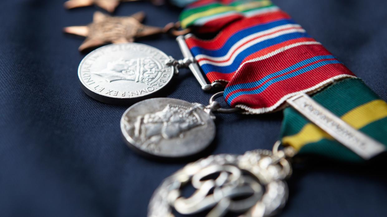 Strip of military medals in a row.