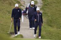 Team USA's Jordan Spieth and Team USA's Justin Thomas walk to the third green during a practice day at the Ryder Cup at the Whistling Straits Golf Course Thursday, Sept. 23, 2021, in Sheboygan, Wis. (AP Photo/Jeff Roberson)